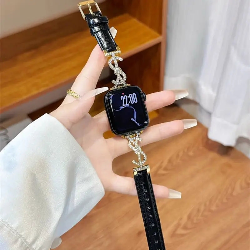 Black leather Apple Watch band with jeweled S connector – closeup on wrist