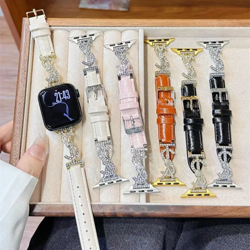 “Black leather Apple Watch band with jeweled S connector – closeup on wrist”