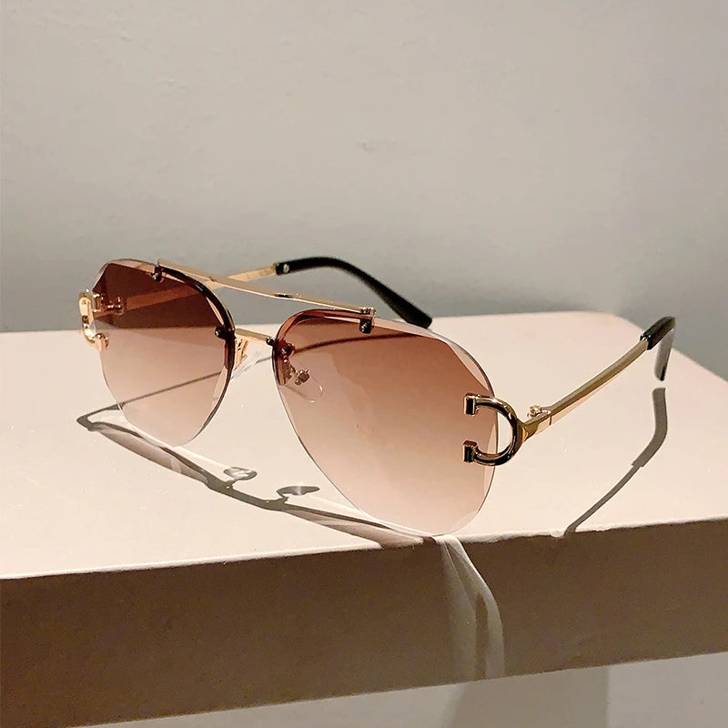 rimless aviator sunglasses with double bridge gold frame and black gradient lenses