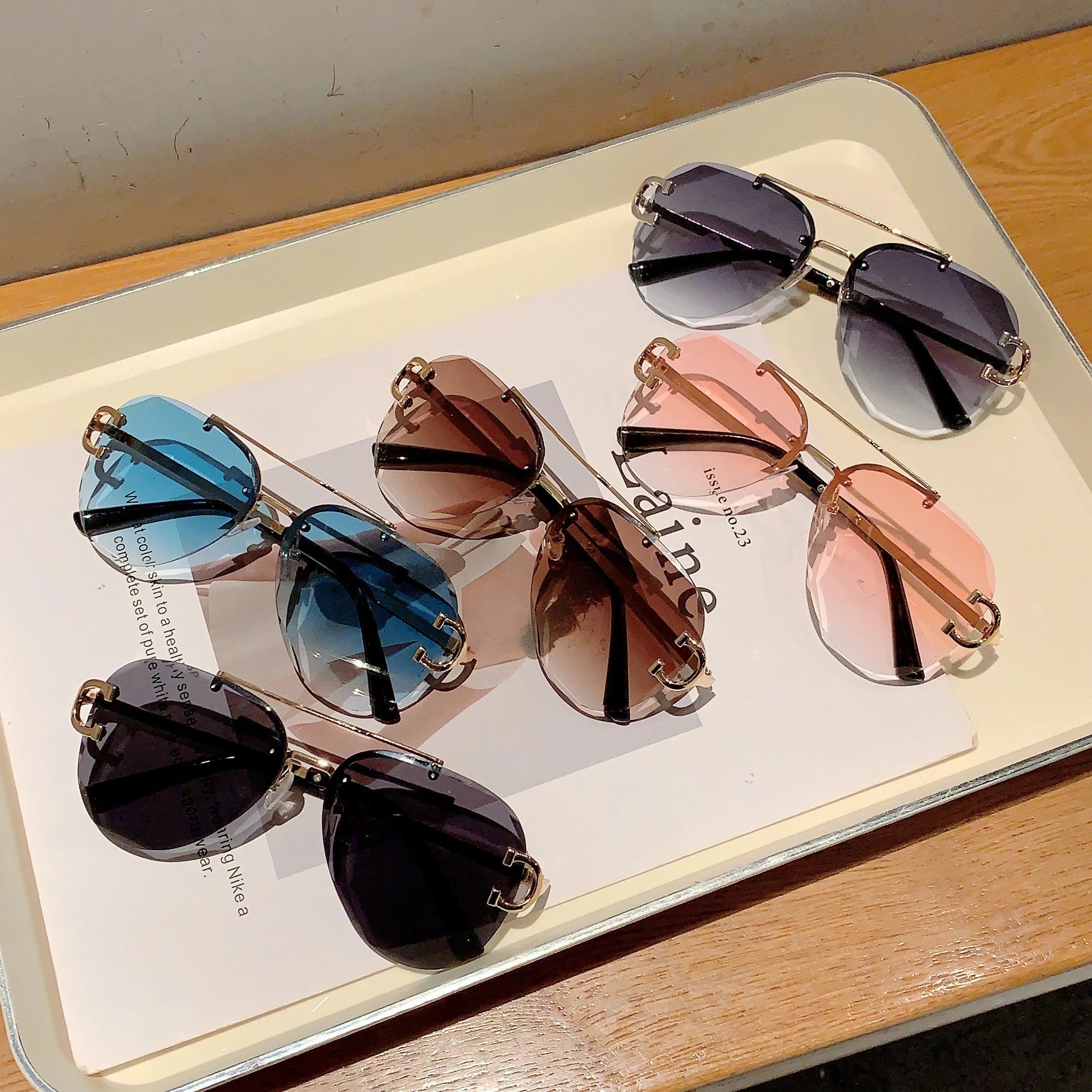 rimless aviator sunglasses with double bridge gold frame and black gradient lenses