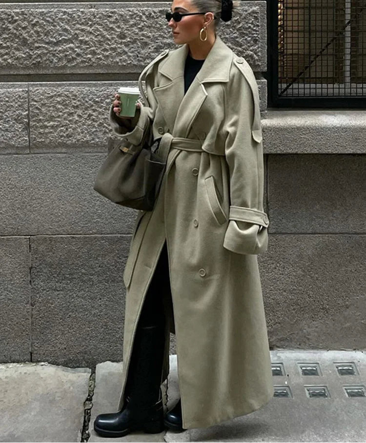 olive oversized long coat with belt and wide sleeves street style look