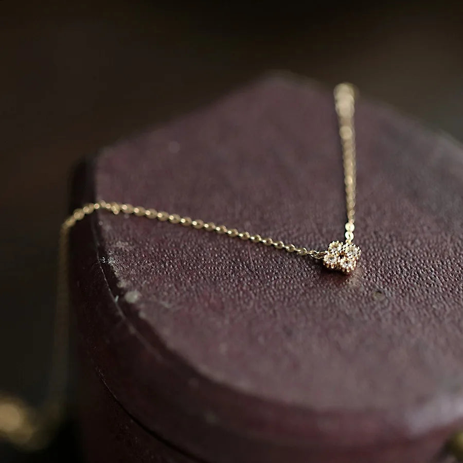 Dainty gold vermeil flower pendant necklace on model