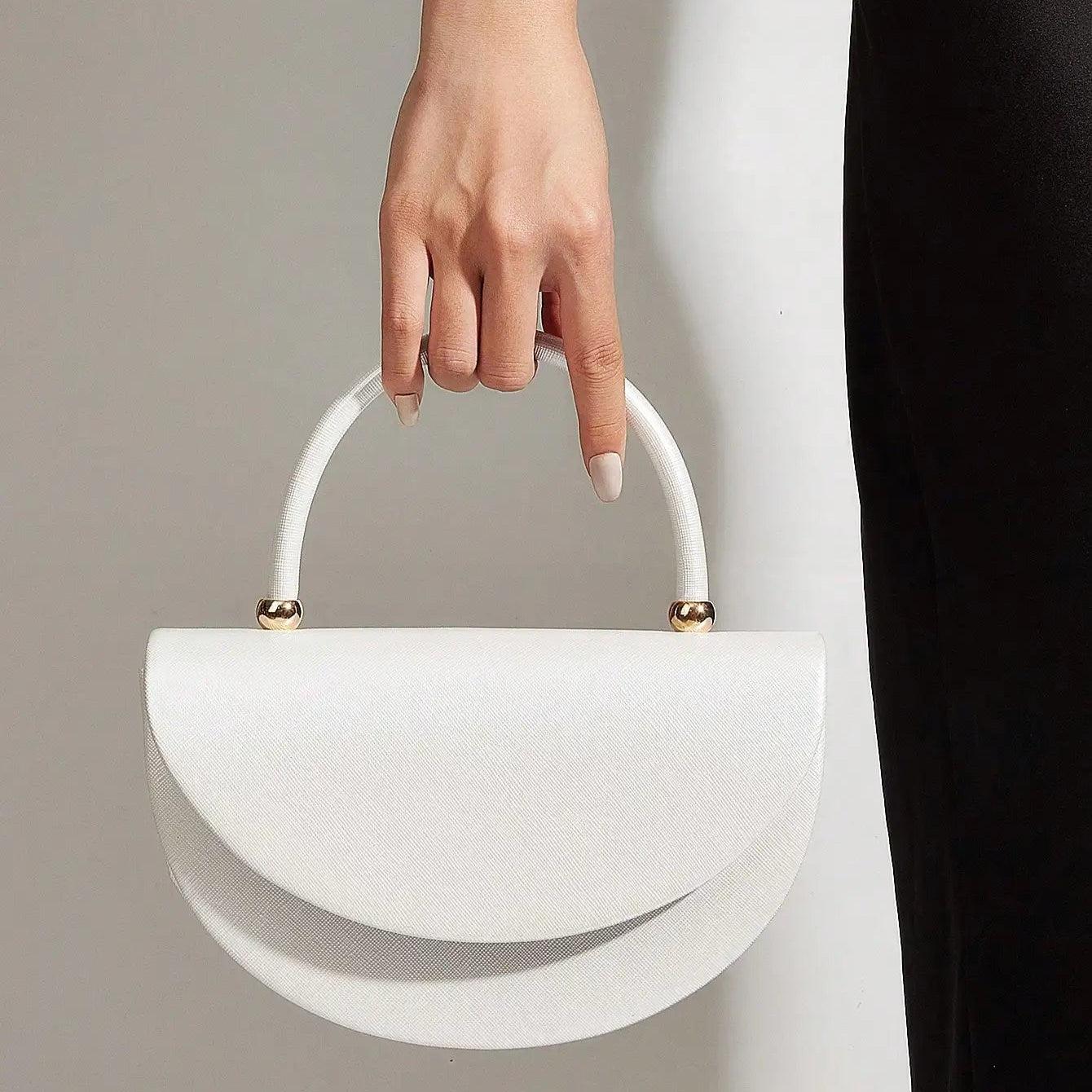 Gold ruched handle half-moon evening clutch, front view