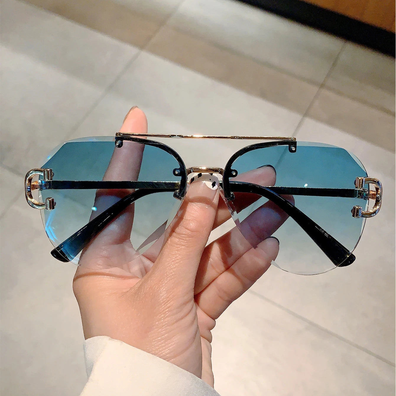 rimless aviator sunglasses with double bridge gold frame and black gradient lenses