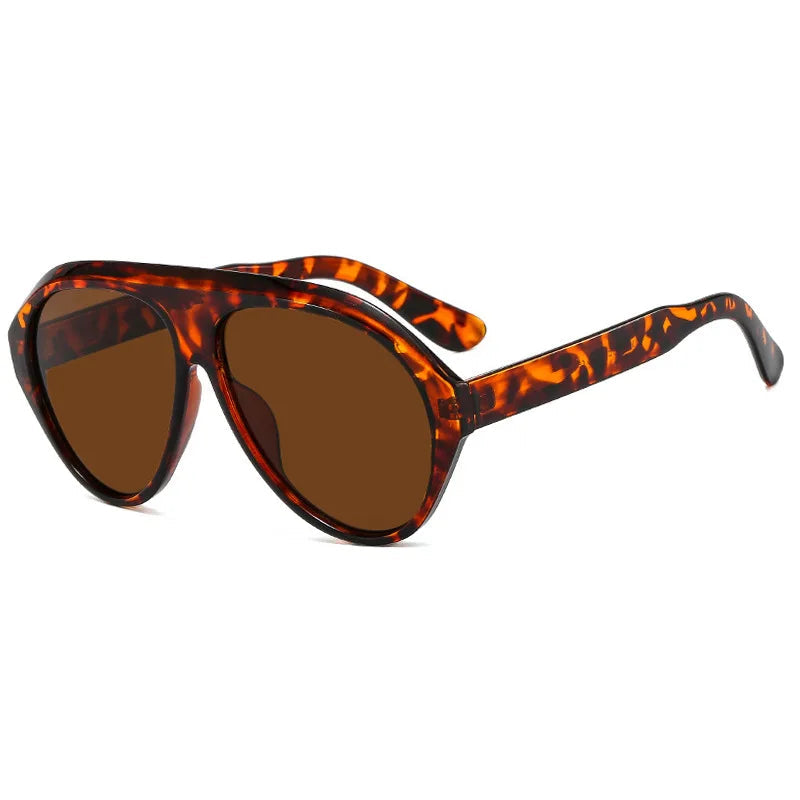 Sunglasses with tortoiseshell frame and brown lenses on a white background