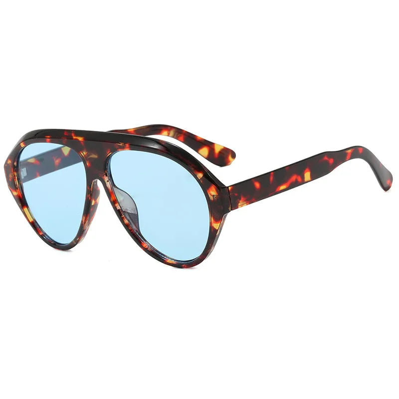 Sunglasses with tortoiseshell frame and blue lenses on a white background