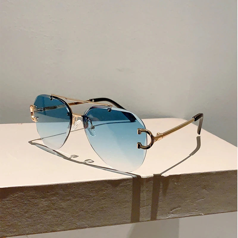 rimless aviator sunglasses with double bridge gold frame and black gradient lenses