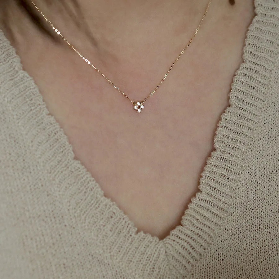 Dainty gold vermeil flower pendant necklace on model