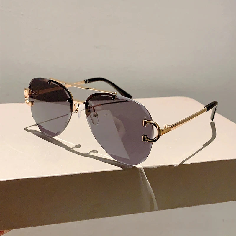 rimless aviator sunglasses with double bridge gold frame and black gradient lenses