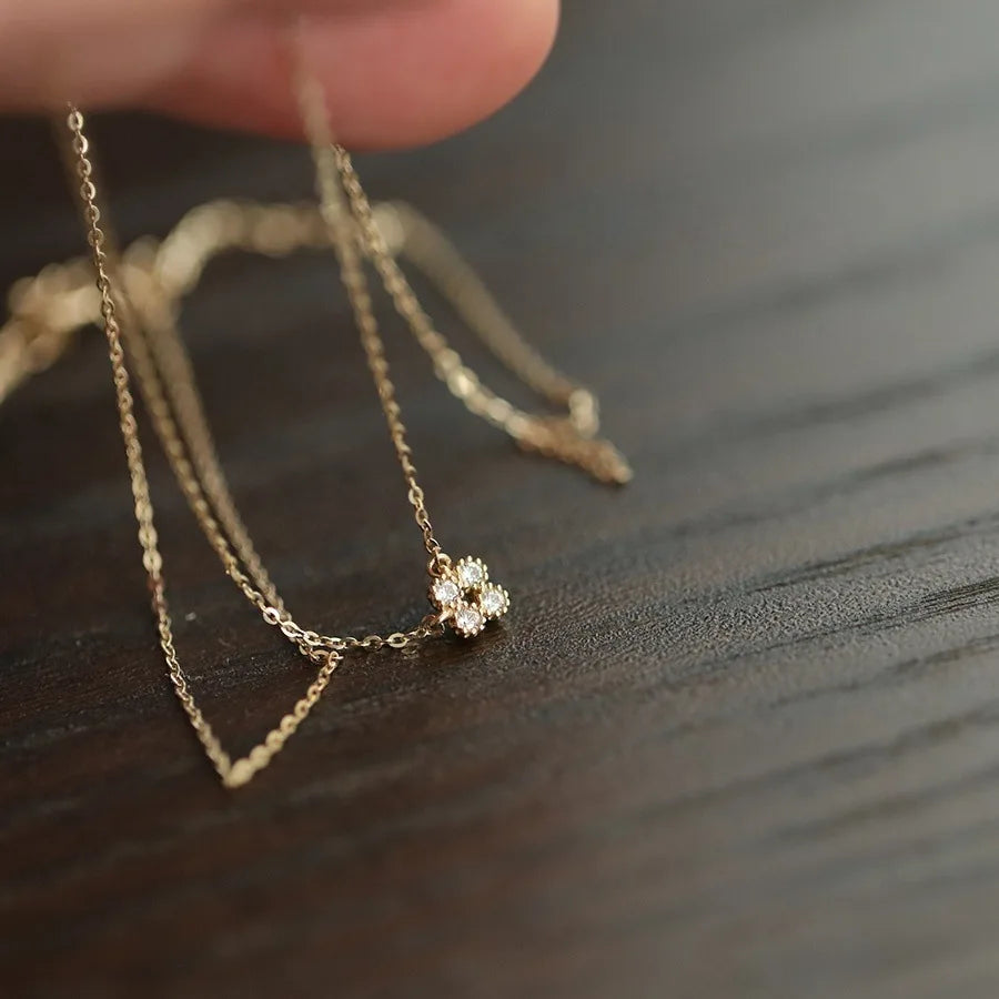 Dainty gold vermeil flower pendant necklace on model