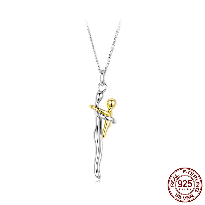 Silver and gold dancer pendant on a white background with 'Real Sterling Silver 925' stamp.
