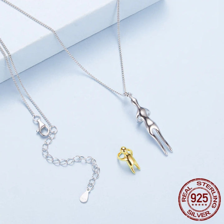 Silver and gold necklaces on a light blue background with Murps branding.