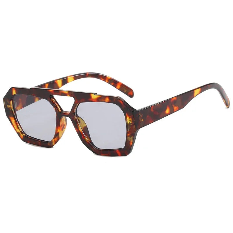 color lineup of oversized square sunglasses in black tortoise brown amber blue and rose