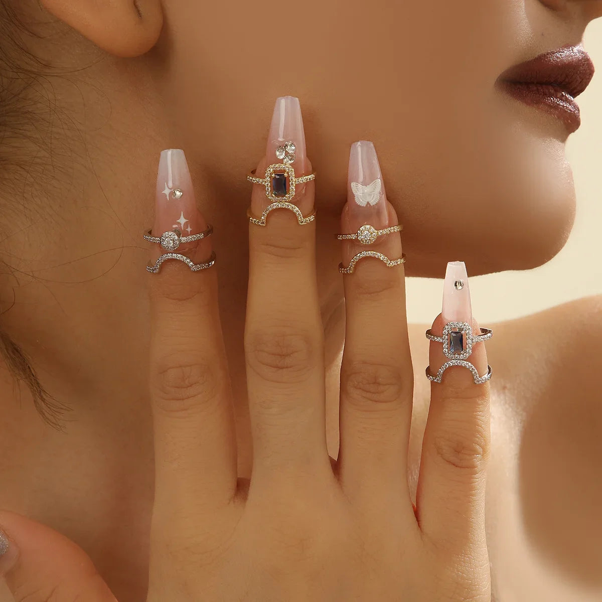 Gold pavé double-band adjustable ring with blue emerald-cut stone