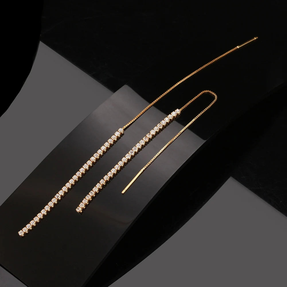 Gold hair accessories with clear beads on a black and gray gradient background, branded as Murps Jewels.