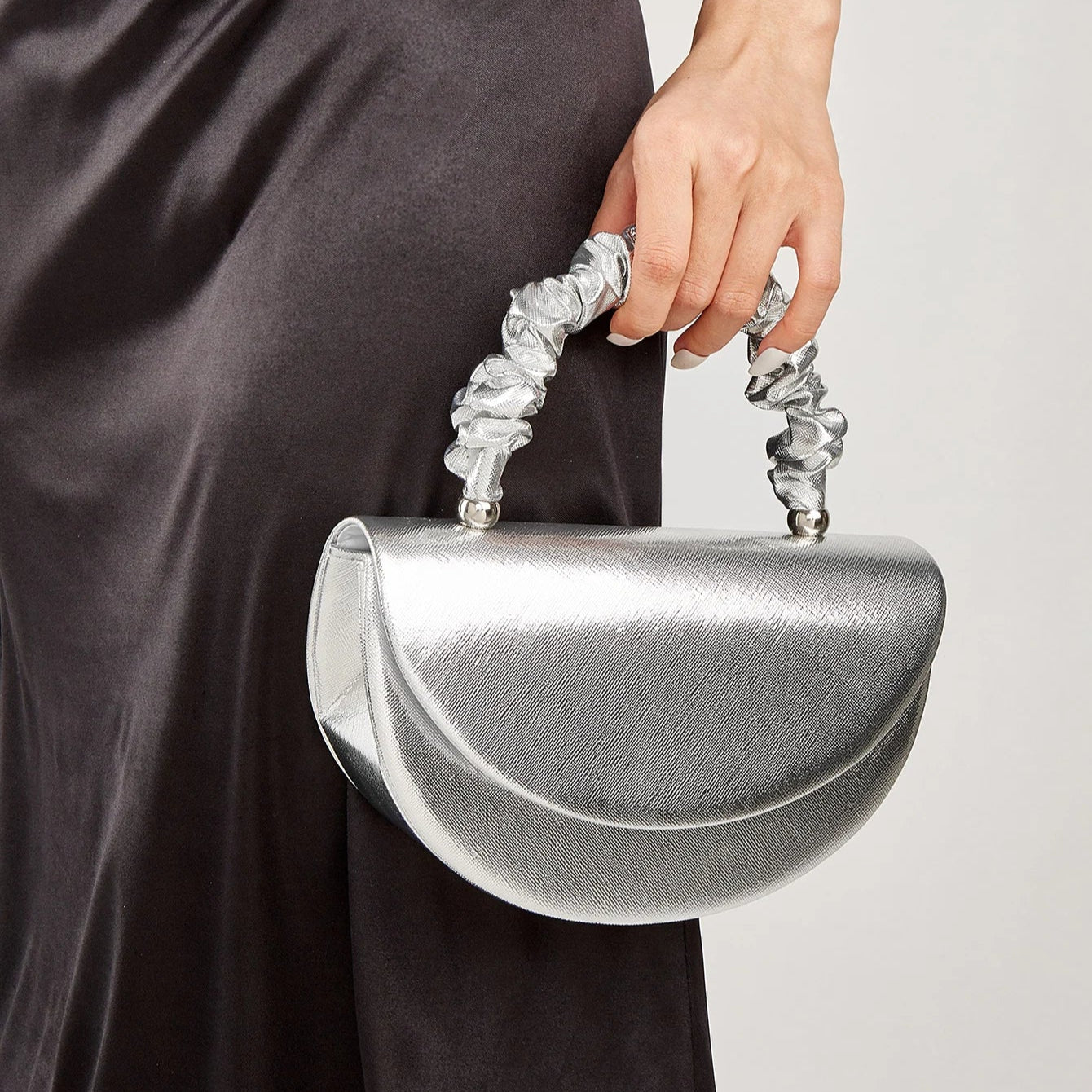 Gold ruched handle half-moon evening clutch, front view