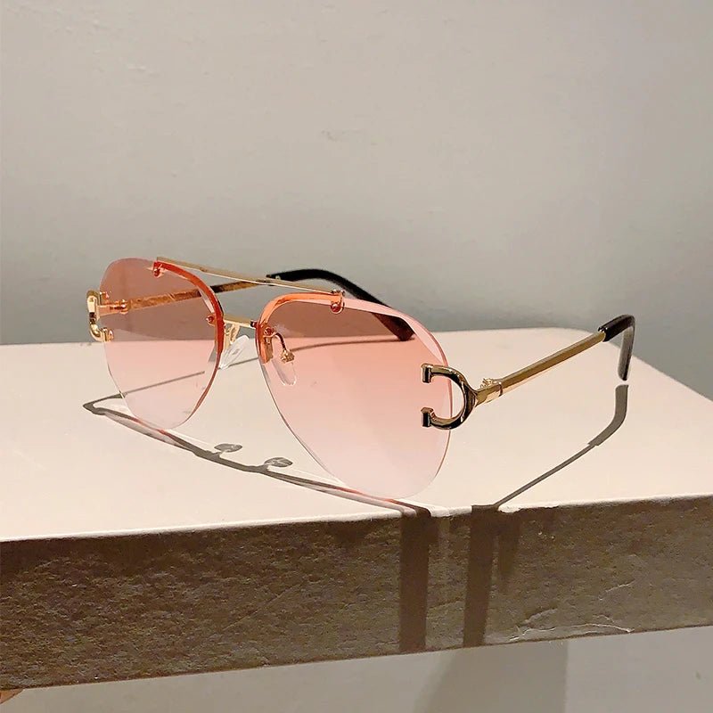 rimless aviator sunglasses with double bridge gold frame and black gradient lenses