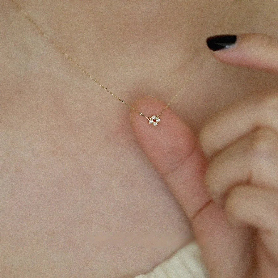 Dainty gold vermeil flower pendant necklace on model